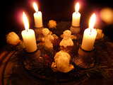 Advent wreath with lit candles...