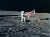Astronaut Charles Conrad and the U.S. flag...