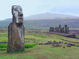 Lonely Maoi statue and row of Maoi statues at Ahu Tongariki...